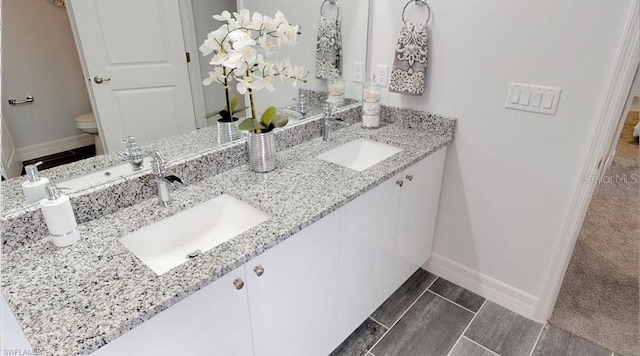 bathroom with vanity and toilet