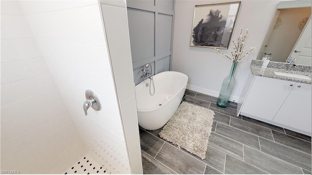 bathroom featuring vanity and separate shower and tub