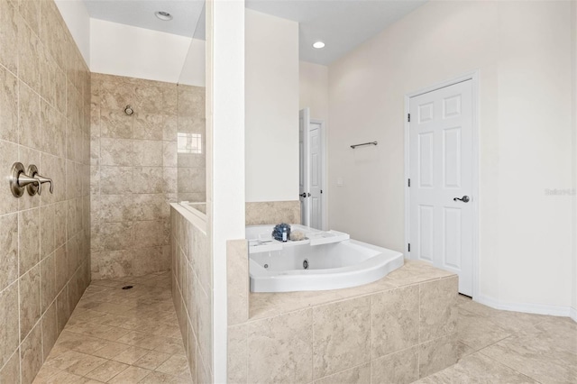 bathroom featuring independent shower and bath