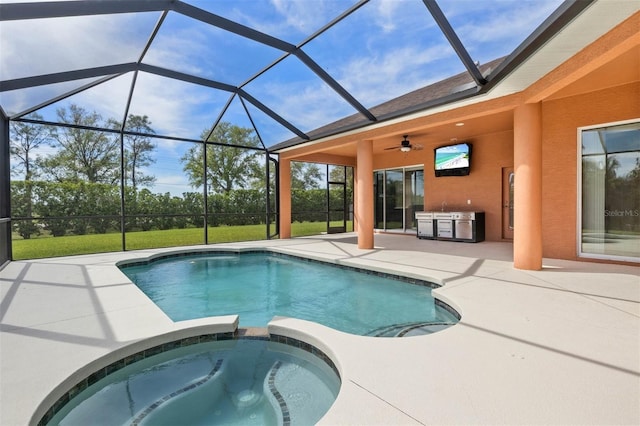 view of pool with an outdoor kitchen, a lanai, an in ground hot tub, ceiling fan, and a patio