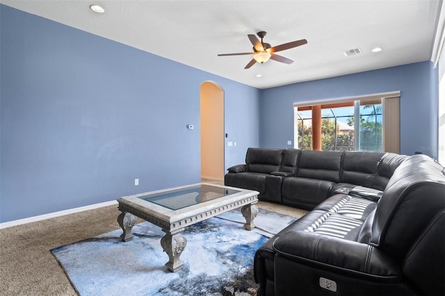 living room featuring carpet floors and ceiling fan