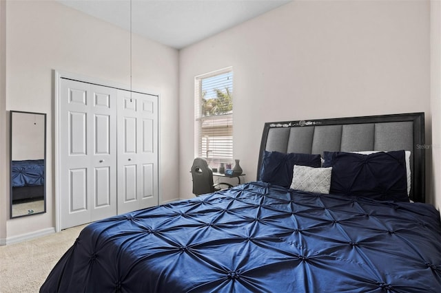 bedroom with carpet flooring and a closet