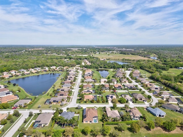 bird's eye view with a water view