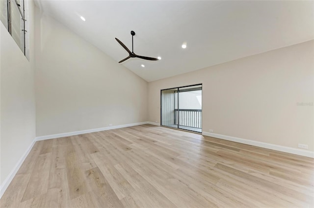 spare room with ceiling fan, high vaulted ceiling, and light hardwood / wood-style flooring