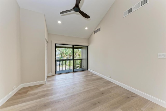 unfurnished room featuring ceiling fan, high vaulted ceiling, and light wood-type flooring