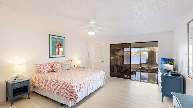 bedroom with wood-type flooring, a textured ceiling, access to outside, a closet, and ceiling fan