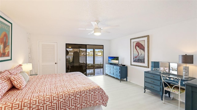 bedroom featuring access to outside, ceiling fan, and light hardwood / wood-style flooring