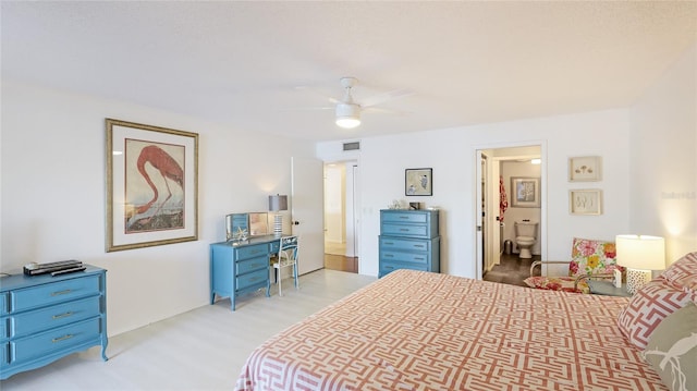 bedroom with connected bathroom and ceiling fan