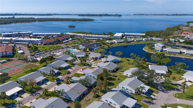 birds eye view of property with a residential view and a water view