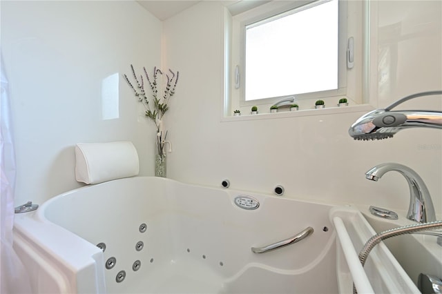 bathroom with a jetted tub