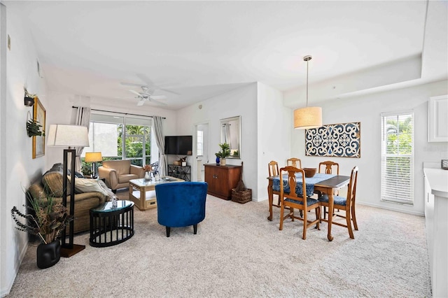 carpeted living room featuring ceiling fan