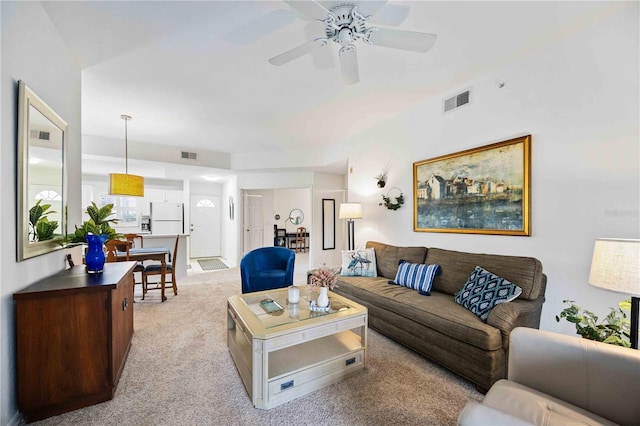 living room featuring ceiling fan and light colored carpet