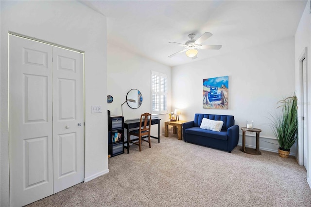 interior space with ceiling fan and light carpet