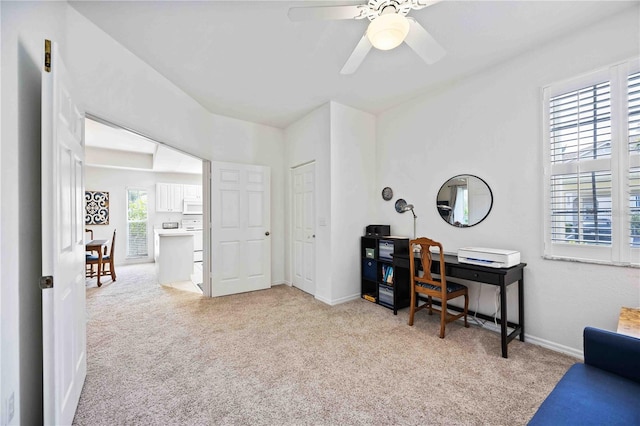 office area featuring light colored carpet and ceiling fan