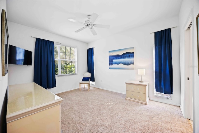 bedroom with ceiling fan and carpet floors