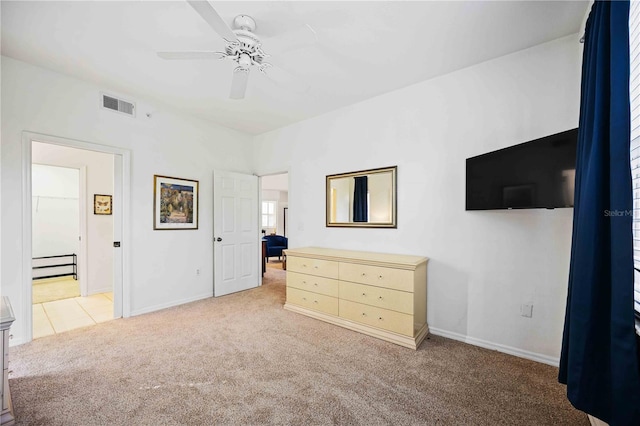 bedroom with light carpet and ceiling fan