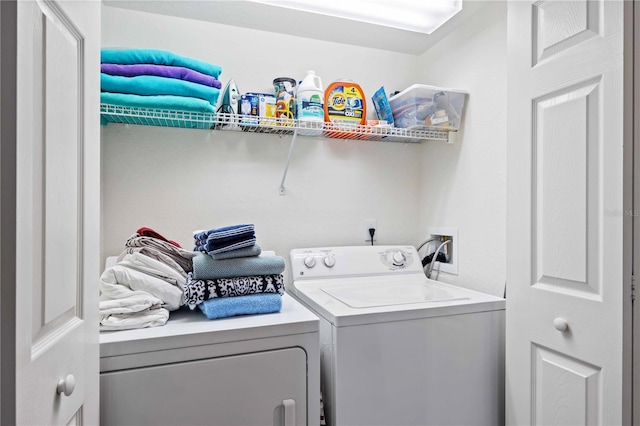 washroom with separate washer and dryer