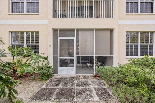 entrance to property with a patio area