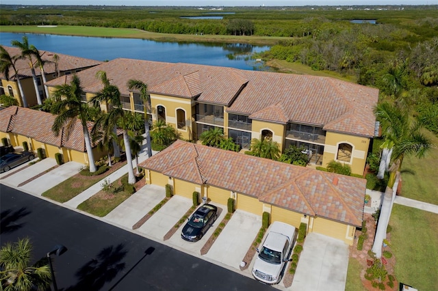 birds eye view of property featuring a water view