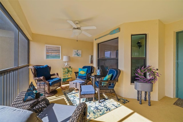 sunroom with ceiling fan