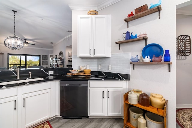 kitchen featuring tasteful backsplash, white cabinetry, dishwasher, sink, and crown molding