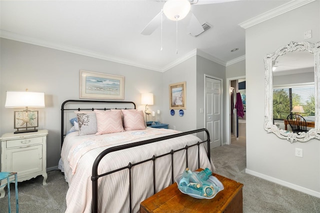 bedroom with crown molding, light colored carpet, ceiling fan, and a closet