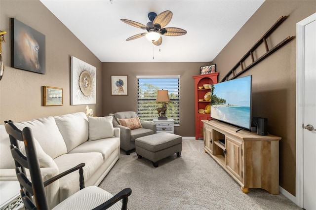 carpeted living room featuring lofted ceiling and ceiling fan