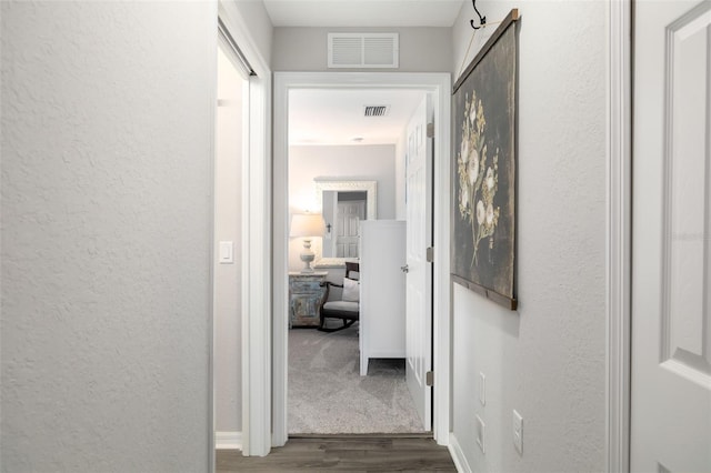 hall with dark wood-type flooring