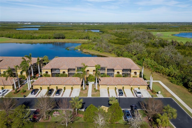 birds eye view of property featuring a water view