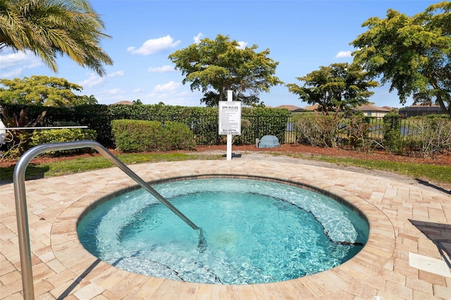 view of pool with a community hot tub