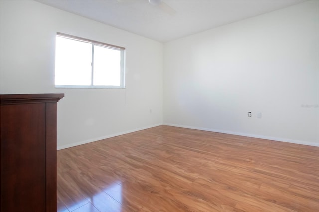 unfurnished room with light hardwood / wood-style flooring and ceiling fan