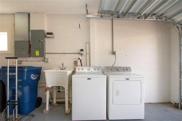 laundry area with washer and clothes dryer and electric panel