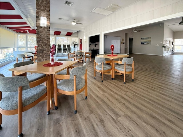 dining space featuring hardwood / wood-style floors and ceiling fan