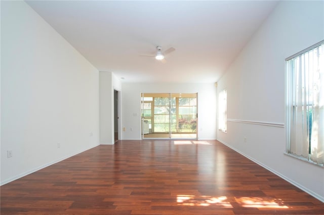 unfurnished room featuring dark hardwood / wood-style flooring and ceiling fan