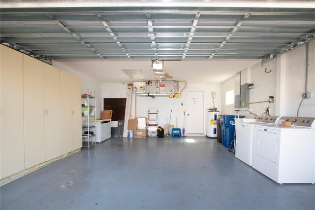 garage with a garage door opener, washer and clothes dryer, electric panel, and electric water heater