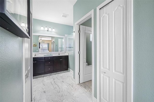 bathroom featuring vanity and an enclosed shower