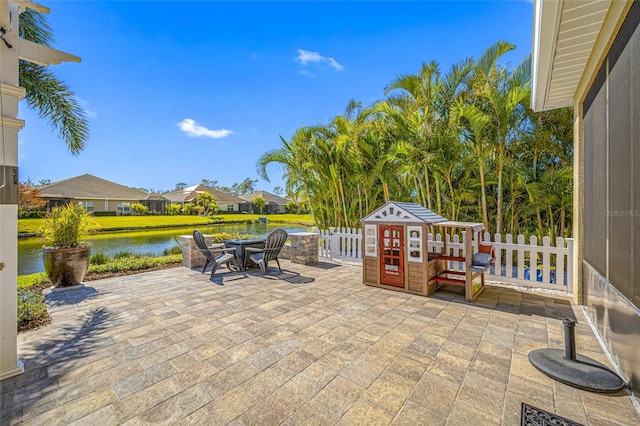 view of patio with a water view