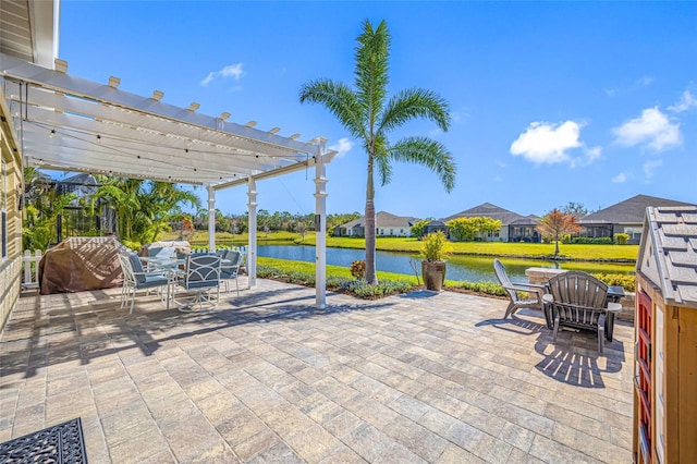 view of patio / terrace with a water view and a pergola