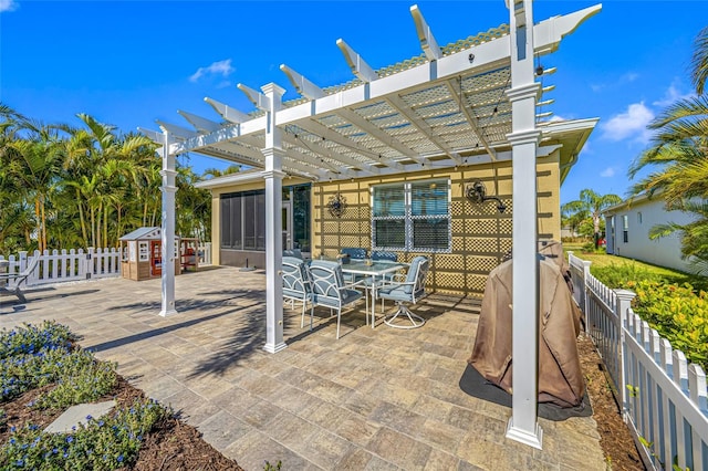 view of patio with a sunroom and a pergola