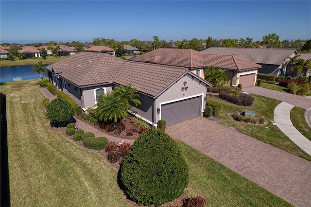 birds eye view of property with a water view