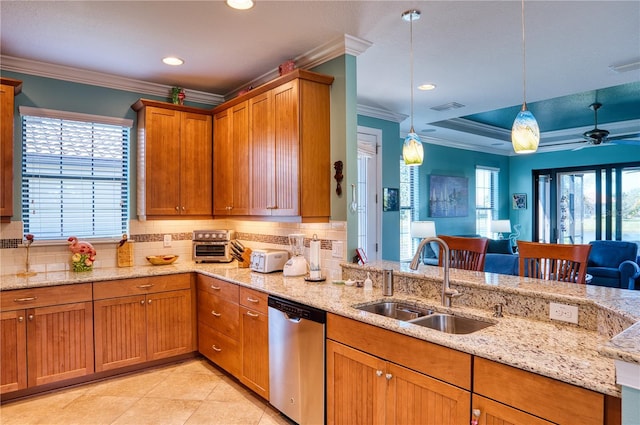 kitchen with tasteful backsplash, dishwasher, sink, hanging light fixtures, and crown molding