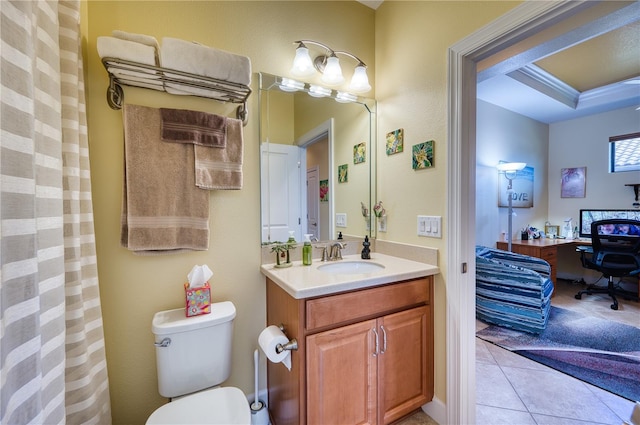 bathroom with tile patterned flooring, vanity, and toilet