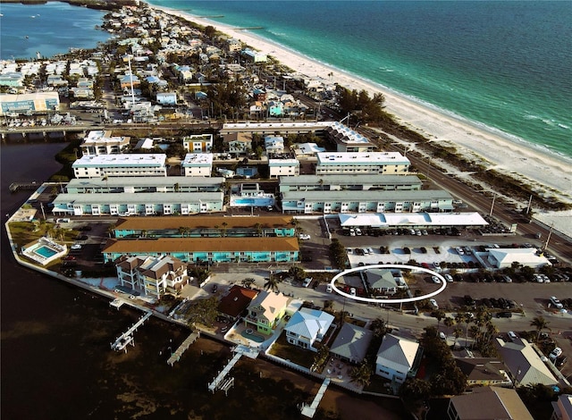 aerial view featuring a water view and a beach view