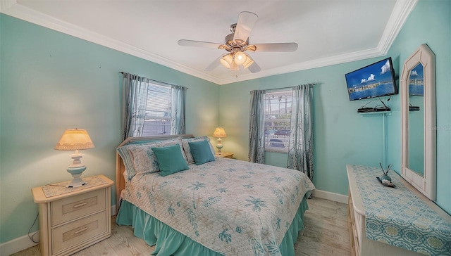 bedroom with multiple windows, crown molding, and light hardwood / wood-style flooring