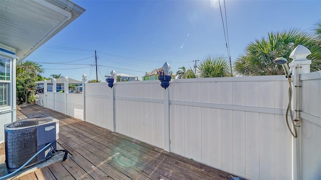 wooden terrace with central air condition unit