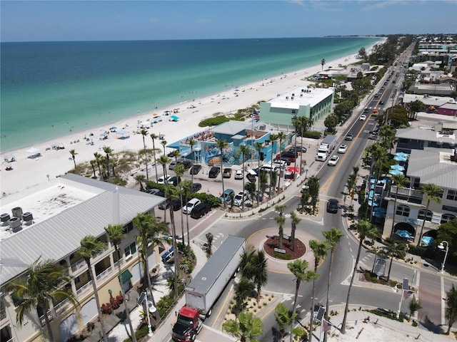 drone / aerial view with a water view and a beach view