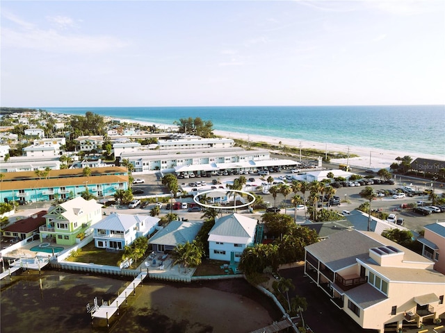 bird's eye view with a water view and a beach view