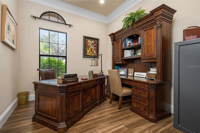 home office with ornamental molding and dark wood-type flooring