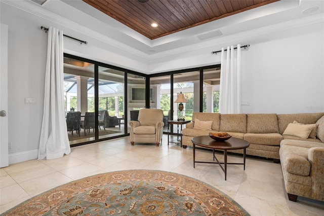 tiled living room with crown molding, a raised ceiling, and wooden ceiling