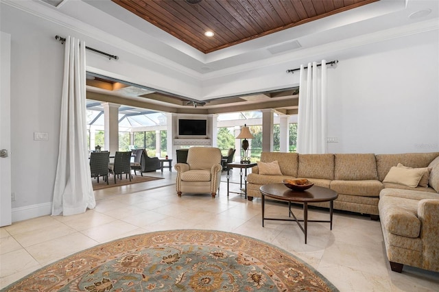 tiled living room with a tray ceiling, ornamental molding, and wooden ceiling